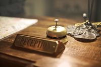 reception-desk-with-antique-hotel-bell-3771110